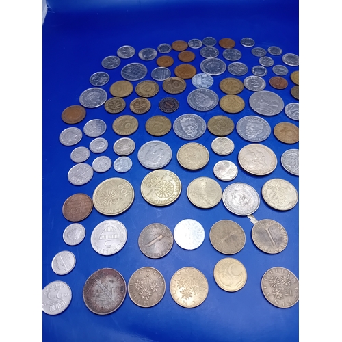 664 - A large collection of 136 assorted foreign coins from various global origins. The collection include... 