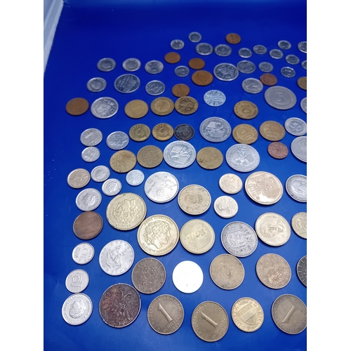 664 - A large collection of 136 assorted foreign coins from various global origins. The collection include... 