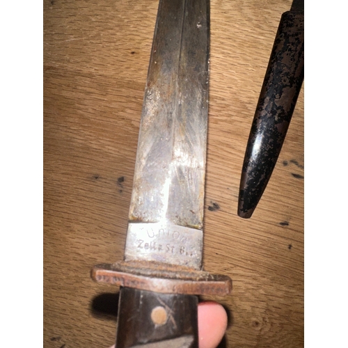 99 - This lot consists of a fixed-blade military fighting knife, identified through consensus as a World ... 