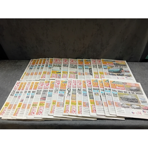 28 - This lot comprises 56 English-language print media items, specifically automotive newspapers and mag... 