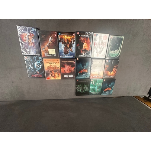 7 - A collection of approximately 60 DVDs consisting of feature films, multi-disc box sets, and music pe... 