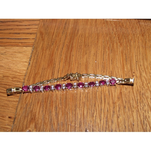 64 - Superb outstanding quality 18ct gold fully hallmarked  bracelet  consisting of  9  oval shape rubies... 