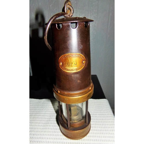 14 - A GPO marked Miners Lamp. Black painted body with brass fittings. Brass badge marked GPO Patterson l... 