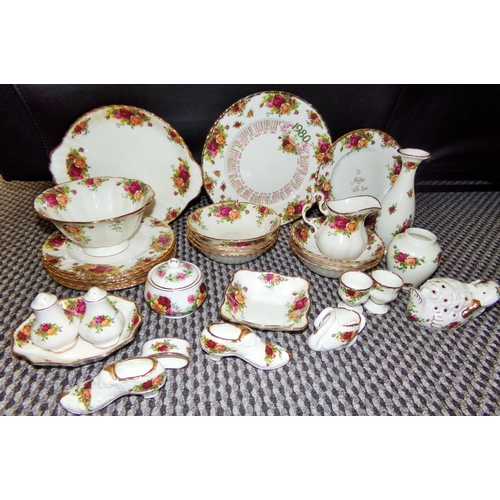 24 - Good selection of mixed Royal Albert Country roses Inc. plates , bowls ,vases salt& pepper, milk jug... 