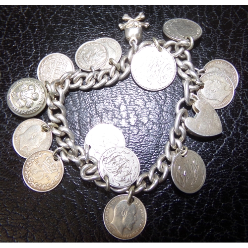 32 - Very unusual silver charm bracelet with each link marked comprising of silver coins with engraved na... 