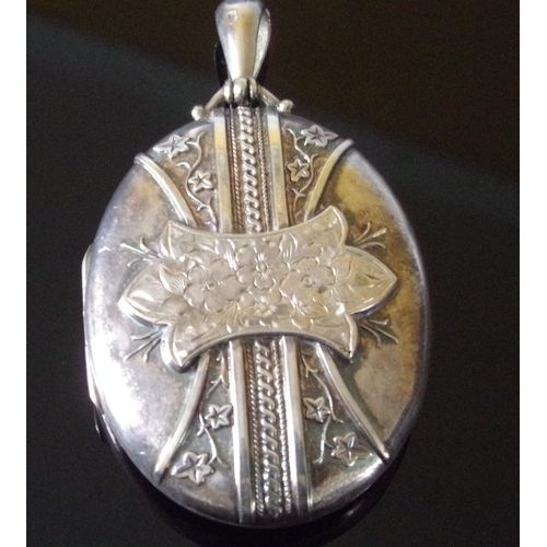 57 - Ornate antique large silver locket with ornate raised decoration & cartouche 22.8g approx. 5x4cm app... 