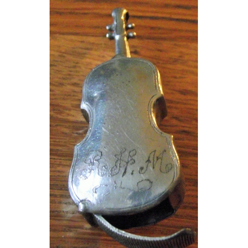 46 - Unusual  base metal  match striker in the form of a double bass instrument ( Initialled on reverse R... 