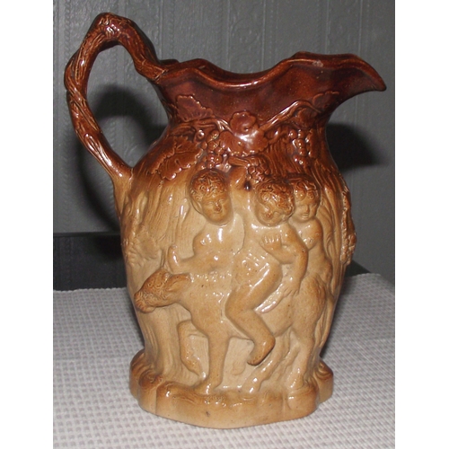 101 - Rare stoneware Brampton ware Silenus ewer, handle formed as a vine covered branch with 3 figures to ... 