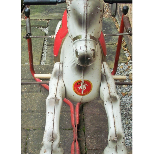 16 - A Mobo child's tin rocking horse With sprung action and tubular frame,  40x35