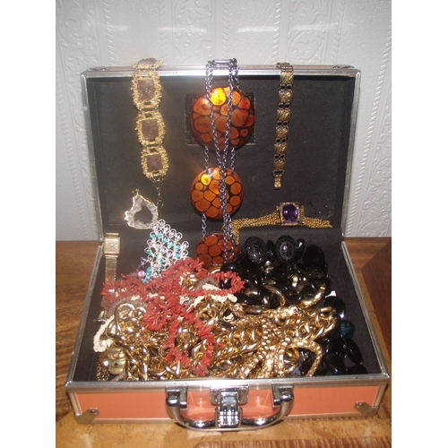 29 - metal vanity case  of good  assorted costume jewellery inc beads, bracelets , plated crystal penanda... 