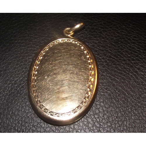 65 - Locket marked internally 14k with enamel  decorated front  4x3cm approx 16.9g approx