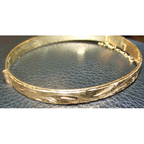 76 - Ladies 9ct gold  solid bangle  with diamond cut design 11.4g approx  6x5.5cm