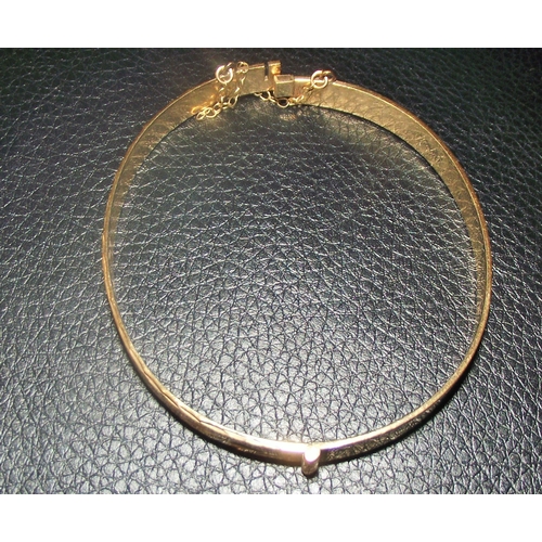 76 - Ladies 9ct gold  solid bangle  with diamond cut design 11.4g approx  6x5.5cm