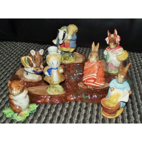 99 - 7x Beswick Beatrix Potter figures and rare stand