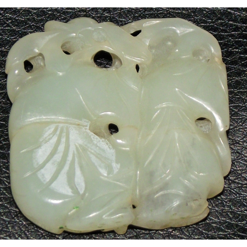 33 - 19thc white jade pendant/ netsuke formed as 2 chldren hiding among foliage with quality detail and p... 