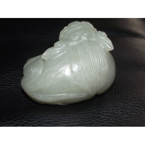 35 - 19thc chinese green jade carved as a dragon holding a ball carved in the round 6x4cm approx