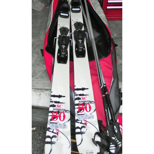 99 - Set if single camber bandit skis, poles and bag