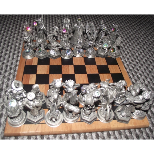 102 - Full set Fantasy of the crstal chess set with figures holding crystals on an associated chess board