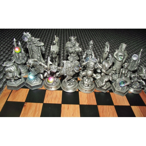 102 - Full set Fantasy of the crstal chess set with figures holding crystals on an associated chess board