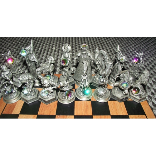 102 - Full set Fantasy of the crstal chess set with figures holding crystals on an associated chess board