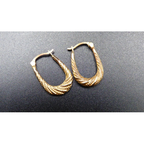 22 - Gold 375 Etched U Shaped Hoop Earrings with Presentation Box
0.8 grams