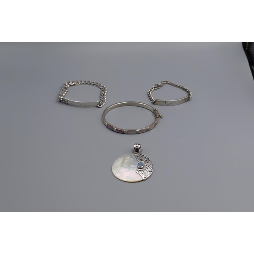 86 - Selection of Silver Jewellery including ID Bracelets Pendant and Bangle