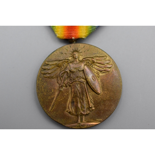 44 - A WWI USA Victory Medal with three bars and Ribbon