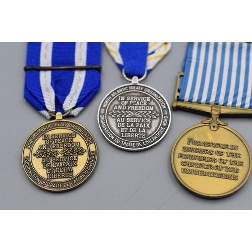 64 - Three Nato Medal's including British Issue Korean, Meritorious Service and Iraq all come complete wi... 