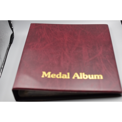 71 - Medal Album containing 14 Sheets of 12 Pouches