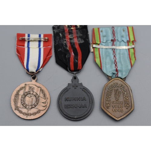 87 - Three WWII Medal's including Republic of France 1939-1945 with Allemagne Bar, Finland Commemorative ... 