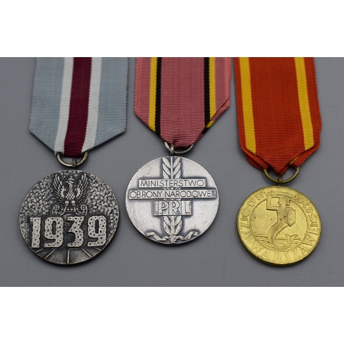 90 - Three Medal's all complete with Ribbons including Polish Defence of Warsaw, Medal for Warsaw 1939 -1... 