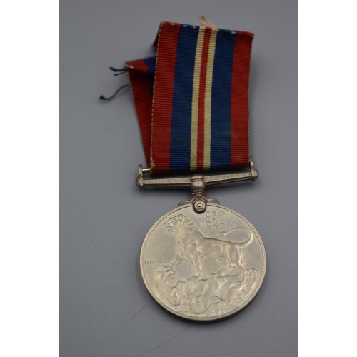 115 - WWII British war medal with ribbon