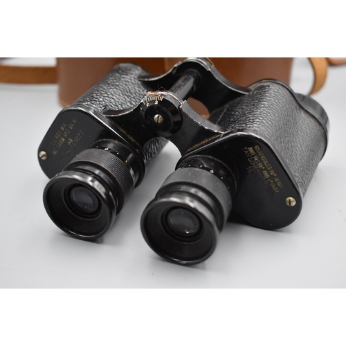 123 - WWII British Military binoculars by Taylor Hobson dated 1943 with a brown leather case. Optics good