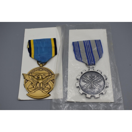 55 - Four Different US military medals with ribbons