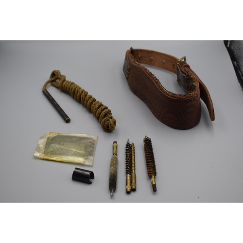 70 - Various Gun cleaning Items, plus a leather strap with a buckle. The leather is marked Parker Hale