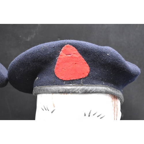 99 - Two Black army Berets. One has an officers Bullion badge for the Royal Corps of signals