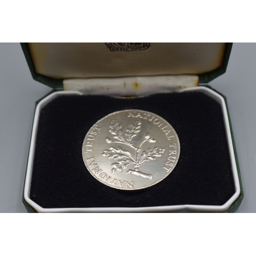 74 - A Hallmarked silver 'Royal Mint National Trust' coin, engraved 'F.L. Selden, London 1986', boxed, 26... 