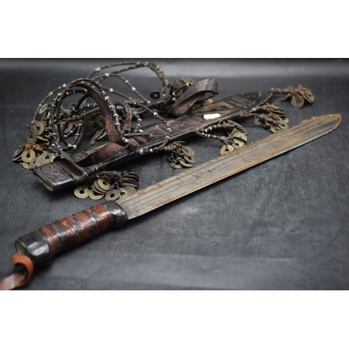 143 - Vintage African Sword. The Mirror Panelled Scabbard is Decorated with over a Hundred Coins on Leathe... 