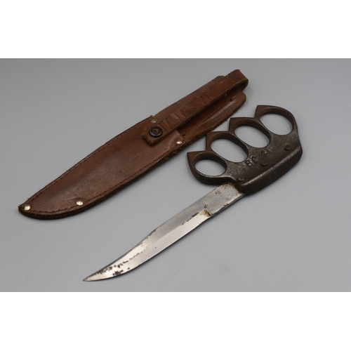 184 - A Second World War BC 41 Commando Knuckleduster Knife, with 13.5cm single edge hatchet tip steel bla... 