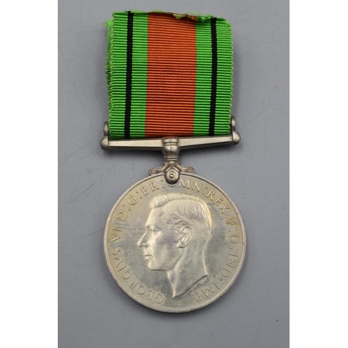 117 - WWII British Defence Medal with Ribbon. Full Size