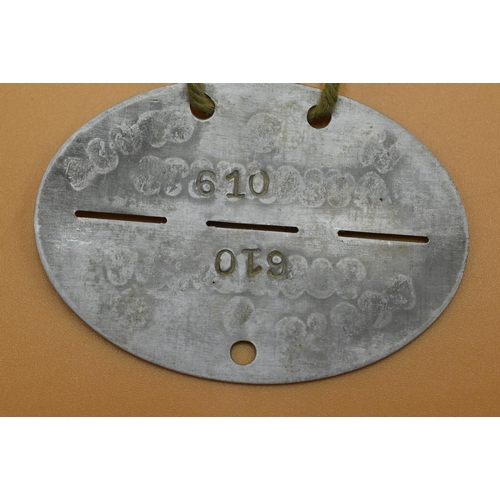 148 - WWII German SS Dog Tag Auschwitz numbered 610