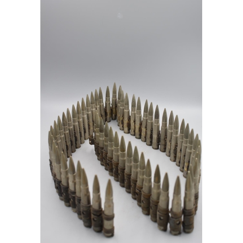 162 - Sixty Inert Nickel Plated 7-9mm Mauser Bullets on a belt, each marked BPD 953