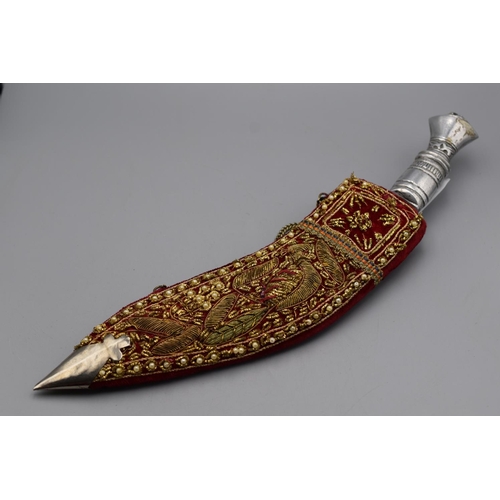 94 - Kukri Knife with a metal grip and a gold bullion decorated velvet covered scabbard. 31cm long