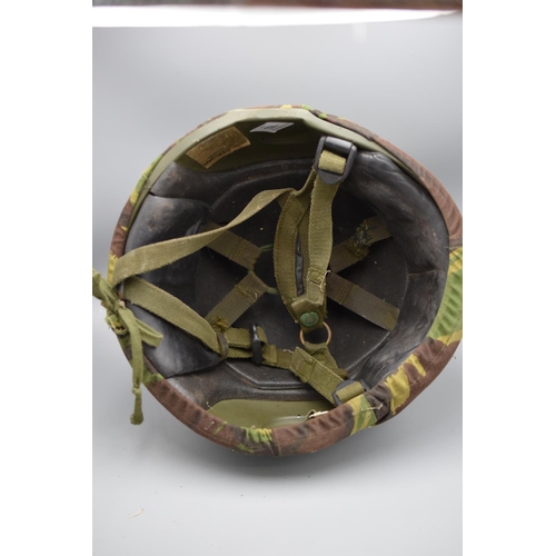 103 - British army combat helmet GS mark 6, with liner and chinstrap. plus a camouflaged outer cover