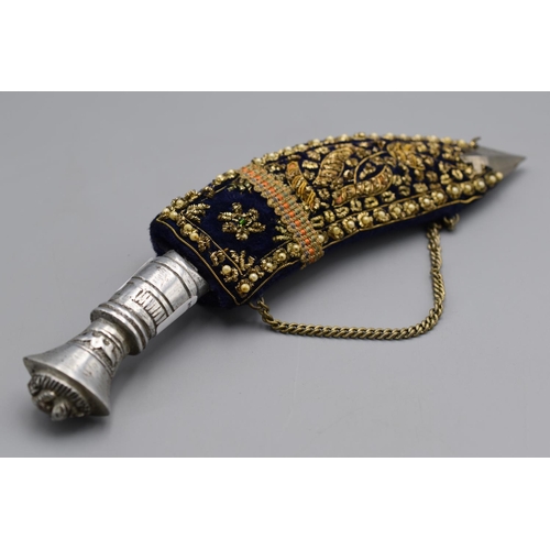 108 - Kukri knife with a metal grip with a gold bullion decorated velvet covered scabbard. 23cm long