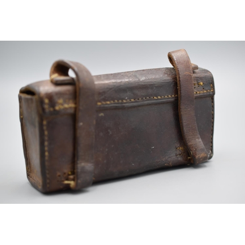 110 - Brown leather military ammo pouch with a brass stud and two rear belt loops