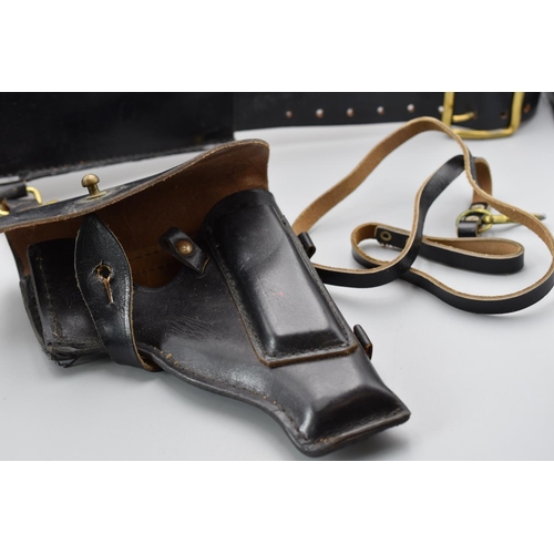 116 - Black leather military belt. Brass Buckle. Plus a black leather pistol holster with Russian markings... 