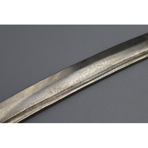 139 - Indian sword with a curved etched blade plus a scabbard. 90cm long