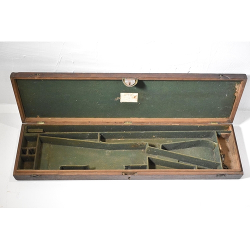 155 - Nineteenth century oak rifle case with a brass ring handle on the lid. Green felt lining. Inner comp... 