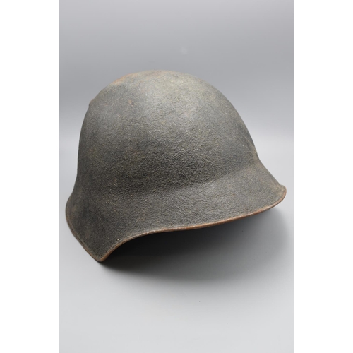 182 - Pre 1943 Swiss army M18 combat helmet with liner and chinstrap. Rough texture outer finish